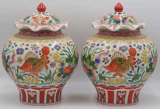 Pair of Chinese Wucai Lidded Jars with Fish.