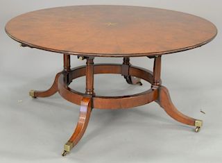 Custom mahogany round dining table with star inlaid center on circular pedestal base fitted with glass top (no leaves). ht. 28 1/2 i...