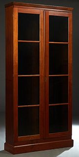 American Carved Walnut Bookcase, 19th c., the cut down crown over double triple glazed panel doors, on a plinth base, H.- 95 in., W.- 46 in., D.- 14 i
