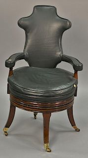 George III style leather swivel office chair, on mahogany base.