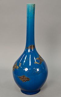 Oriental blue glazed phoenix bird vase having bottle form long neck and paint flying bird amongst clouds. ht. 18 in.