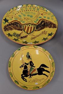 Two Breininger redware pottery chargers including light dragon design (dia. 14 in.) and E Pluribus Unum eagle charger (dia. 22 in.).