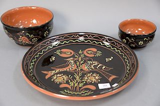 Three Breininger pottery pieces including a charger (dia. 16 1/2 in.) and two bowls.