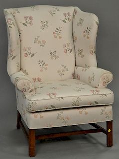 Chippendale style upholstered wing chair.