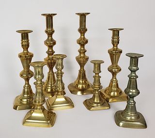 Collection of Eight 19th Century Brass Push-Up Candlesticks