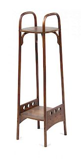 An Otto Prutscher Mahogany Etagere, for Thonet Height 48 1/8 x width 12 1/4 x depth 13 1/2 inches.