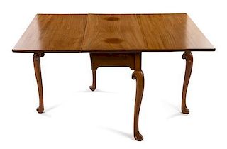 A Queen Anne Style Mahogany Drop-Leaf Table Height 28 x width 18 x 39 inches (closed).