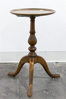 A Georgian Style Walnut Pedestal Table Height 19 1/2 x diameter 11 5/8 inches.