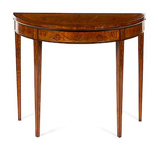 A Sheraton Style Satinwood and Marquetry Flip-Top Game Table Height 30 x width 37 x depth 17 inches (closed).