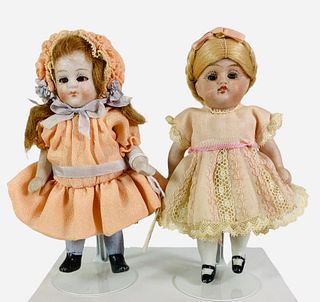 (2) All Bisque Girls. Includes 4 1/2" doll with one-piece head/torso, wire jointed arms and legs, mohair wig, glass sleep eyes, closed mouth, painted 