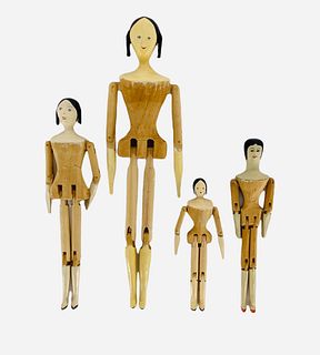 Lot of 4 artisan made peg-wooden dolls ranging from 4 1/2" to 9" tall. Dolls have painted features, no signatures.