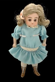 All bisque 6" tall doll w/brown glass inset eyes, painted heeled bootie feet, stationary head, moveable legs/arms.