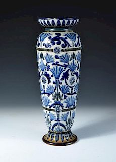 A Doulton Lambeth stoneware vase by Frank Butler, the tall slender form incised and painted in blue