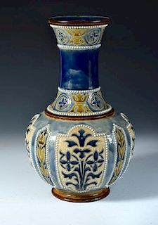 A Doulton Lambeth stoneware vase by George H. Tabor, the bottle form with incised and applied decora