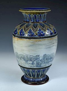 A Doulton Lambeth stoneware vase by Hannah Barlow, the baluster form incised with a frieze of sheep,