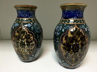 A pair of small Doulton Lambeth Slater patent vases, of baluster form with foliate decorated panels