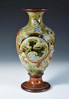 A Royal Doulton stoneware vase by Mark V. Marshall, the baluster form decorated with scrolling folia