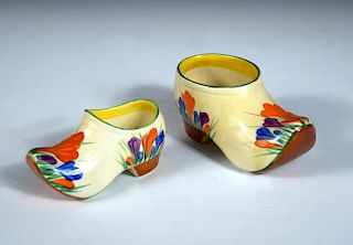 Two Clarice Cliff crocus pattern clogs, each painted in colours, printed marks, the larger 13cm long