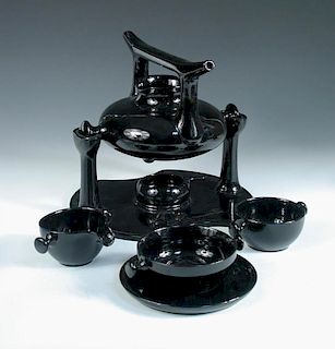 Luigi Colani for Friesland, Melitta, Germany, a black glazed 'Zen' tea service, designed 1973, compr