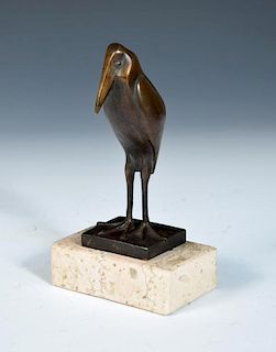 After Francois Pompon, (French, 1855-1933), a patinated bronze model of a stylised stork, mounted on