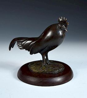 After Francois Pompon, (French, 1855-1933), a patinated bronze model of a cockerel, mounted on a lat