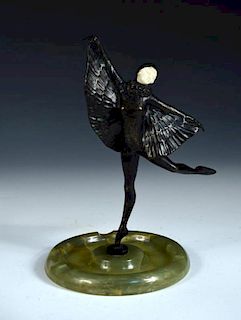An Art Deco bronze and ivory model of a Bat or Butterfly dancer, she stands upon one leg, arms outst