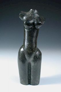A 20th century carved stone female torso, the dark green stone model of the female nude signed with