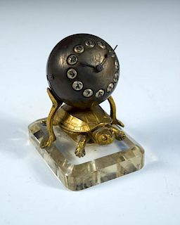 A novelty ormolu tortoise and globe desk timepiece, the ball dial with cabouchon Arabic numerals sup