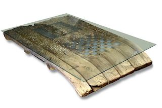 A 19th century threshing board, now mounted as a glass topped coffee table, the slatted frame inset