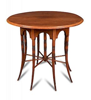 After E. W. Godwin, an Aesthetic period walnut eight leg centre table, circa 1876-85, probably made