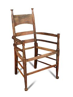 William Birch, a turned oak framed open arm elbow chair, with a deep cresting rail on turned front l