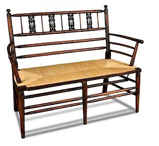 An Arts & Crafts stained beech settle, possibly by Morris & Co., the back rails with Moorish inspire