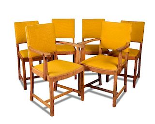 A set of six Heal's walnut dining chairs, comprising two carvers and four standard chairs with musta