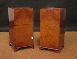 A pair of Art Deco walnut bedside cupboards, the top sections with outward facing open shelves, the