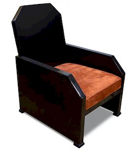 An Art Deco black lacquer armchair in the manner of Jean Dunand, probably French, the facetted back