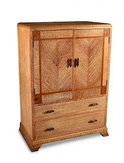An Art Deco limed oak cabinet, the two door cupboard top with walnut inlays above two long graduated