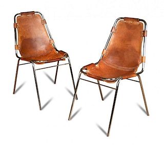 Charlotte Perriand, a pair of 'Les Arc' chairs, chromed steel frames with tan leather (2) 80cm (31in