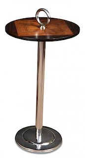 An Art Deco walnut, rosewood and chrome cocktail table, the circular top with central walnut quarter