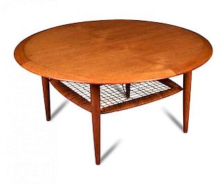 A Danish coffee table, possibly designed by Johannes Andersen, the circular top supported tapering c