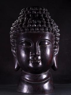 A Carved Zitan Buddha Head