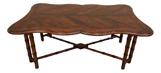 Fauld Cambridge Collection (manufactured in China) shaped top coffee table with hand scraped finish and bamboo style base, 52" x 32" x 20".