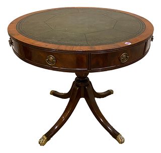 Mahogany four drawer round table with leather top, 32" round x 30" tall. Leather has crazing.