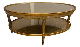 Theodore Alexander oval gilt coffee table with glass top, 48" x 32" x 21"