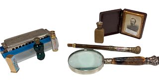 Vintage items harmonica with sharps and flats and three full octaves. Three vintage perfume bottles and lipstick case a handle for a parasol. There al
