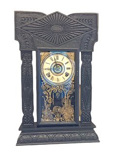 E. Ingraham 8-day clock with alarm. 22.5" high x 14.5" wide. Pendulum and key present but working condition unknown. Crack on glass. Includes shelf.