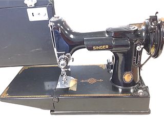 Vintage Singer Featherweight sewing machine with case, serial # aj803175, bobbin holder in office.
