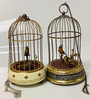 Lot of 2 vintage decorative bird cages w/ music boxes. Ranging from 9.75"-10.25".