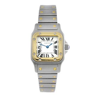 CARTIER - a Santos bracelet watch. Stainless steel case with yellow metal bezel. Reference 35990, se
