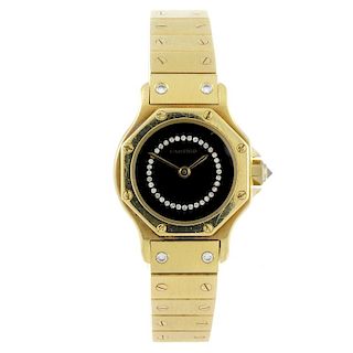 CARTIER - a Santos bracelet watch. 18ct yellow gold case. Signed automatic movement. Black diamond s