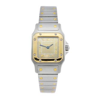 CARTIER - a lady's Santos bracelet watch. Stainless steel case with yellow metal bezel. Reference 15